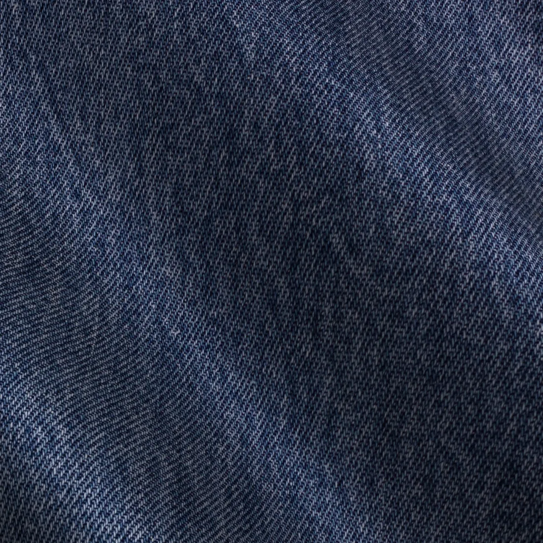 Close study of deep indigo rope-dyed cotton twill
