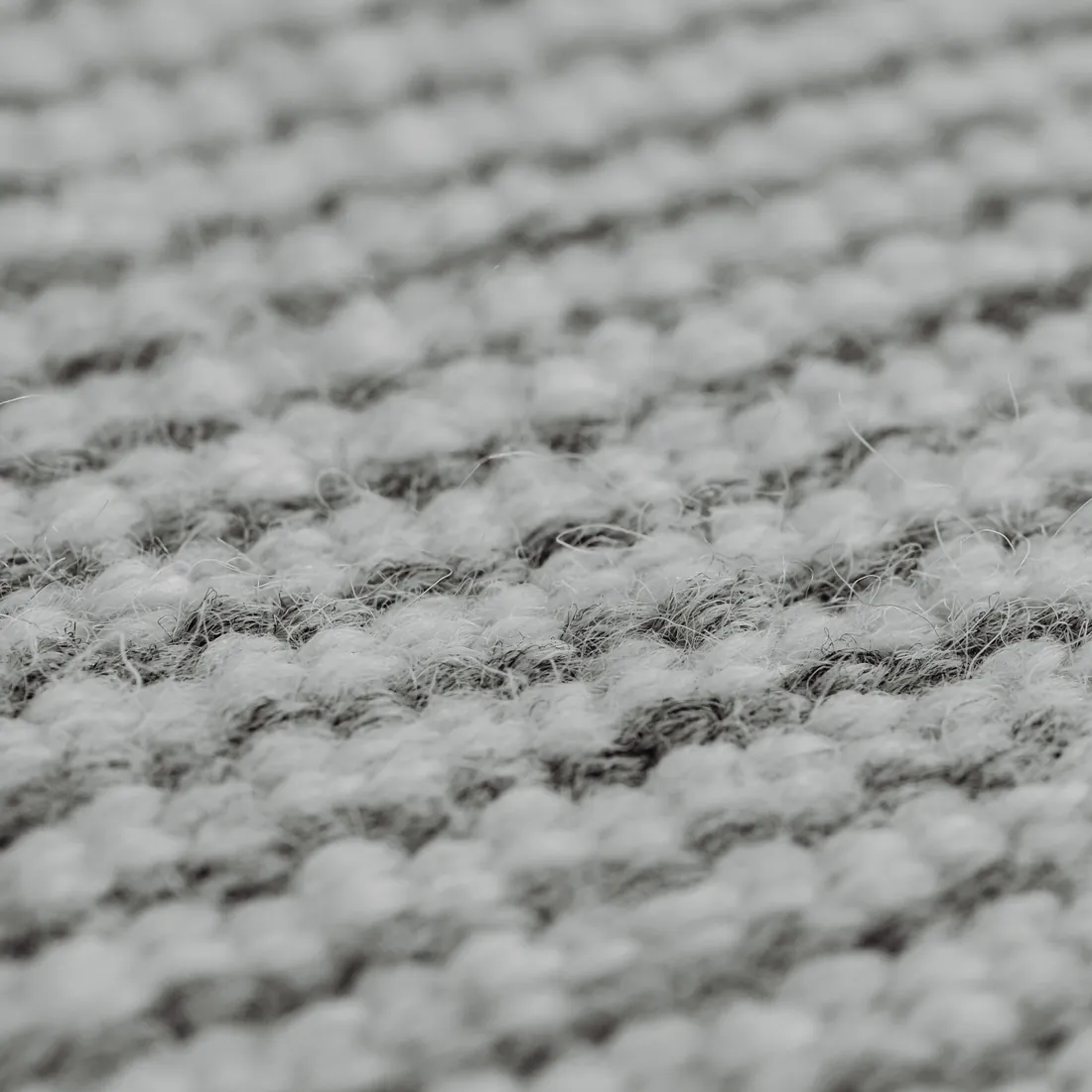 Close study of fog-grey recycled cashmere knit